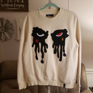 Roku Studio Cream Sweater with Artistic Eye Design L Collectors
